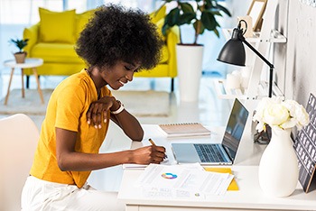 Women at desk working from home