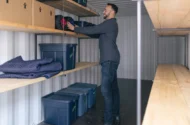 Man loading items into a portable storage container - BigSteelBox